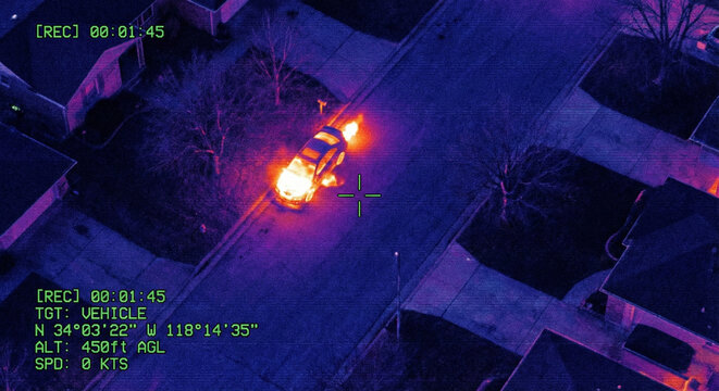 Thermal Imaging Drone View of Car Engine Heat on Night Street