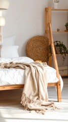 A cozy bedroom with a wooden bed frame, white bedding, and a beige throw blanket draped over it.