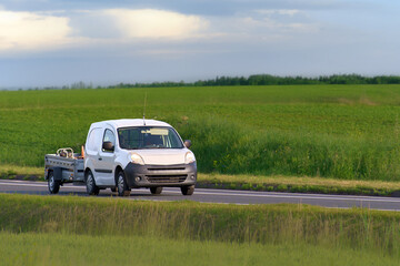 Fototapeta premium Modern MPV family vehicle on scenic rural highway