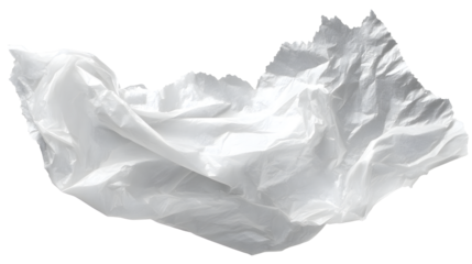 A torn piece of thin white plastic grocery bag crumpled and isolated on a plain white background with plastic bag and environmental and pollution