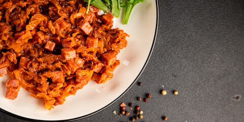 Stewed cabbage with ham cube tomato sauce braised cabbage vegetable healthy food main course ingredient appetizer fresh tasty table setting gourmet food background on the table rustic food  