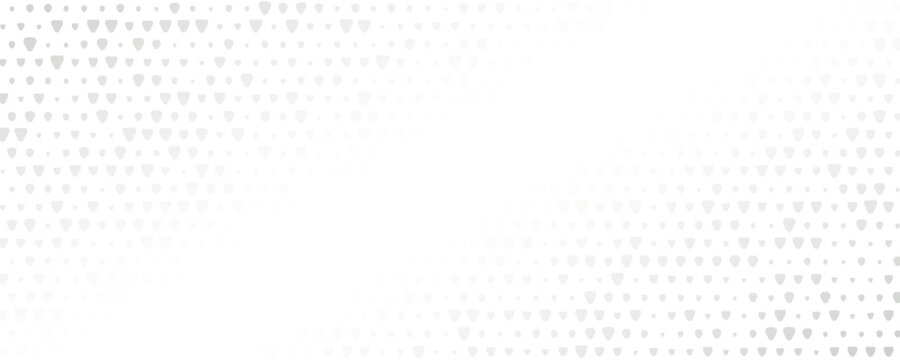 An abstract pattern of grey dots gradually fading into white. The design features a gradient effect, transitioning from dense clusters to sparse dots.