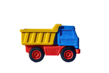 A colorful close-up of a vibrant plastic toy truck isolated against a solid black background