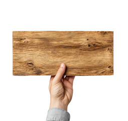 A hand holds up a blank, rectangular wooden sign against a stark black background