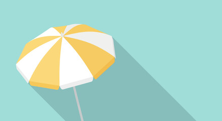 Yellow and white beach umbrella casting a long shadow.
