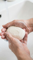Hand washing with bar soap for hygiene and cleanliness