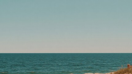 Obraz premium Serene Ocean Landscape with Sandy Beach.