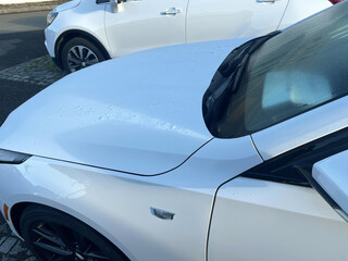 white car for sale on the parking