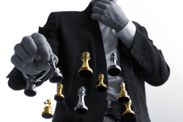 Businessman choosing chess piece from floating set. Concept of founder decision, startup strategy, growth direction, early stage risk, competitive positioning, product focus.