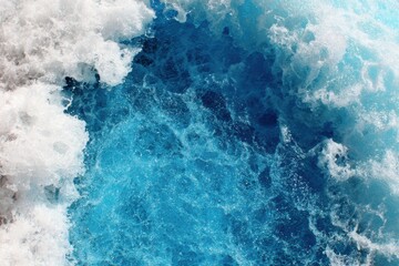 Ocean's Embrace: Witness the raw, untamed beauty of the ocean as frothy white waves crash against the deep, turquoise expanse, a mesmerizing dance of nature's power. 