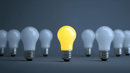 Glowing yellow bulb stands out among unlit white bulbs symbolizing idea and innovation.