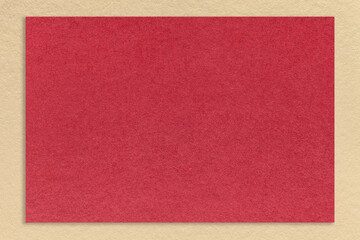 Textured dark red paper background with beige border. Vintage kraft cardboard with frame. Banner with copy space