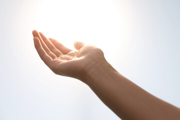Youth Hand Open Palm Against Sky - Hope and Giving Gesture