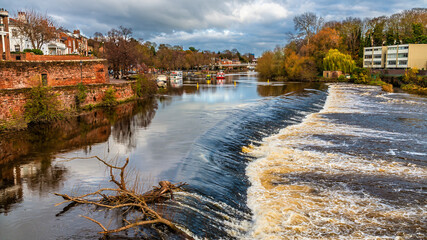 A view from the Old Dee Bridge over the weir on the River Dee in the city of Chester, Cheshire, UK