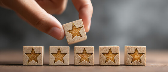 A hand placing a star rating block above a row of existing wooden star blocks
