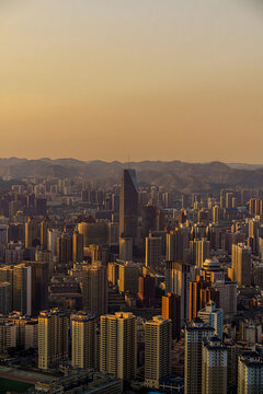 Lanzhou City Skyline at Golden Hour with Mountain Backdrop
