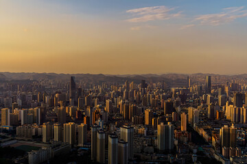 Lanzhou City Skyline at Golden Sunset with Mountains © TranThi