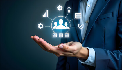 Human resource and team management with businessman holding digital team icon for workforce management, employee data, leadership, and talent analytics