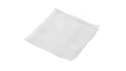 Single white gauze pad with textured surface isolated on black background medical sterile