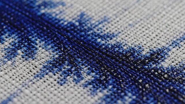Blue thread on white fabric
