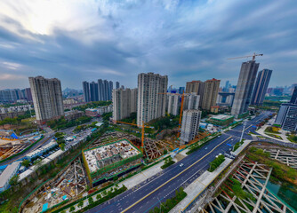 Fototapeta premium Wuhan Aerial View: Modern Building Complexes and Busy Traffic