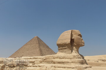 Profile view of the Great Sphinx with a Pyramid in Giza, Egypt