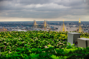 The backdrop of the evening sky along the river, with riverside houses and communities, or tall...