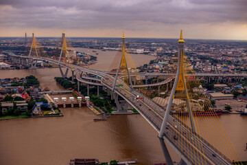 The backdrop of the evening sky along the river, with riverside houses and communities, or tall...