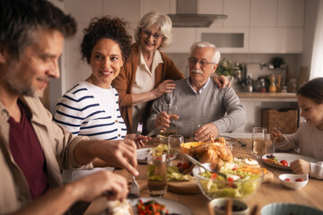 Family generations enjoying holiday lunch together at home