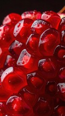 Close-up Macro Shot Of Juicy Ripe Red Pomegranate Seeds With Water Droplets On A Dark Background