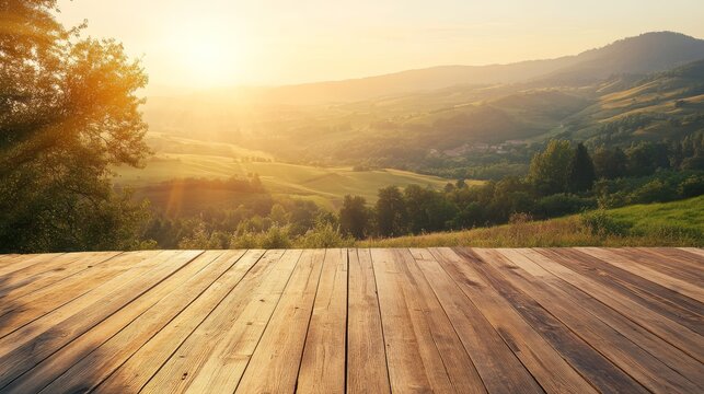 Weathered cedar deck with empty wooden table photographed during golden hour sunrise, overlooking verdant valley landscape wrapped in gentle morning mist, warm sunlight illuminating wooden surfaces