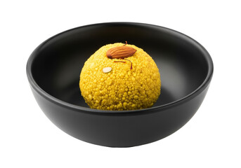 besan ladoo in a black bowl with almond topping, indian festival dessert