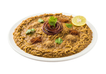 savory pasta dish with brown sauce, lemon wedge, cilantro garnish