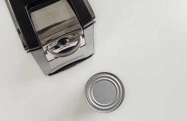 Electric can opener for fast and easy food preparation.