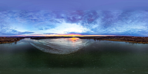 Aerial spherical panorama over Dumbrava Lake in Iași, Romania, at sunset