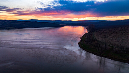 Aerial view over Dumbrava Lake in Iași, Romania, at sunset
