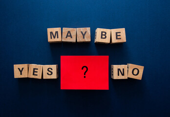 Decision making choices with yes no maybe wooden blocks