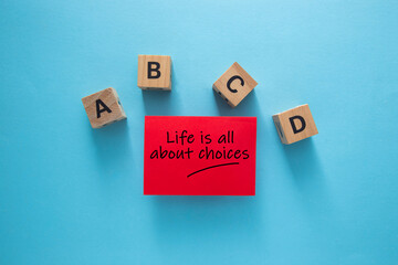 Red sticky note saying life is all about choices