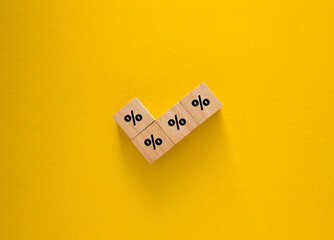 Percentage symbols forming checkmark on yellow background