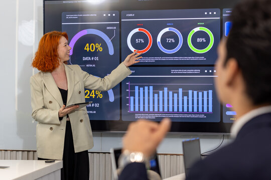 Diverse Team Working Together in Modern Co-Working Space. Casual meeting of senior diverse business team analyzing financial data. Multiethnic business people working in the office. senior man. - Powered by Adobe