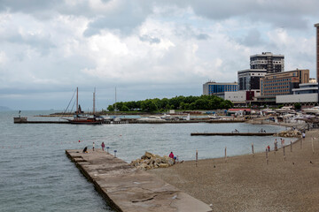 July 28, 2025: Yacht parking along the waterfront in Novorossiysk, Russia, with moored yachts near the coastline, reflecting maritime life and the Black Sea harbor atmosphere