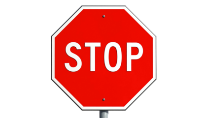 Bright red octagonal stop sign against a dark background, with white letters spelling "STOP
