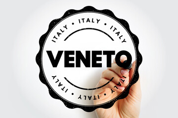 VENETO Italy travel stamp with circular regional seal, hand holding marker emphasizing destination name, tourism concept showing Italian region as official arrival style imprint