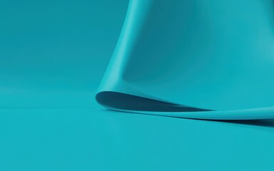 A curled blue fabric casting a shadow on a flat surface viewed from a close-up angle