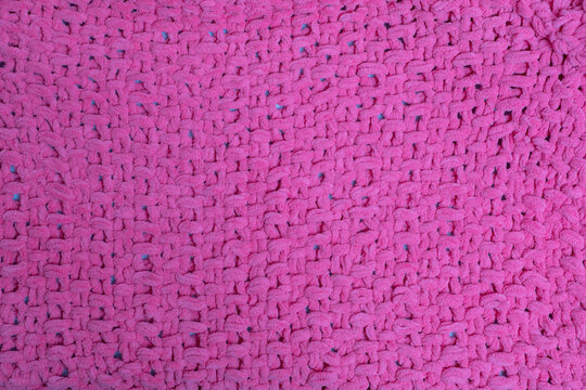 Flauschige Strickjacke Grobstrickmuster in rosa zur Hintergrund und Textur Nutzung