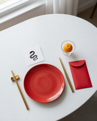 Contemporary Minimalist Chinese New Year Table Setting with Snake Symbol and Clean Design