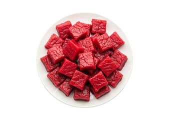 sugar coated red candy cubes on white plate