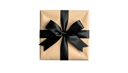 Top-down view of a wrapped present with brown paper and a black satin ribbon bow