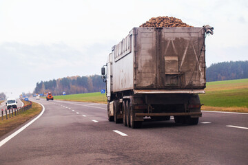 Large semi-trailer truck transport of sugar beets on highway during day heavy vehicle with...