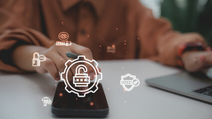 Businessman hand holding smartphone with virtual padlock icon. Concept of cyber security, data protection, digital privacy, and safe access on modern mobile technology.